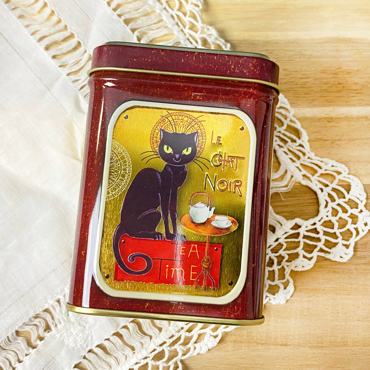 black cat tin side