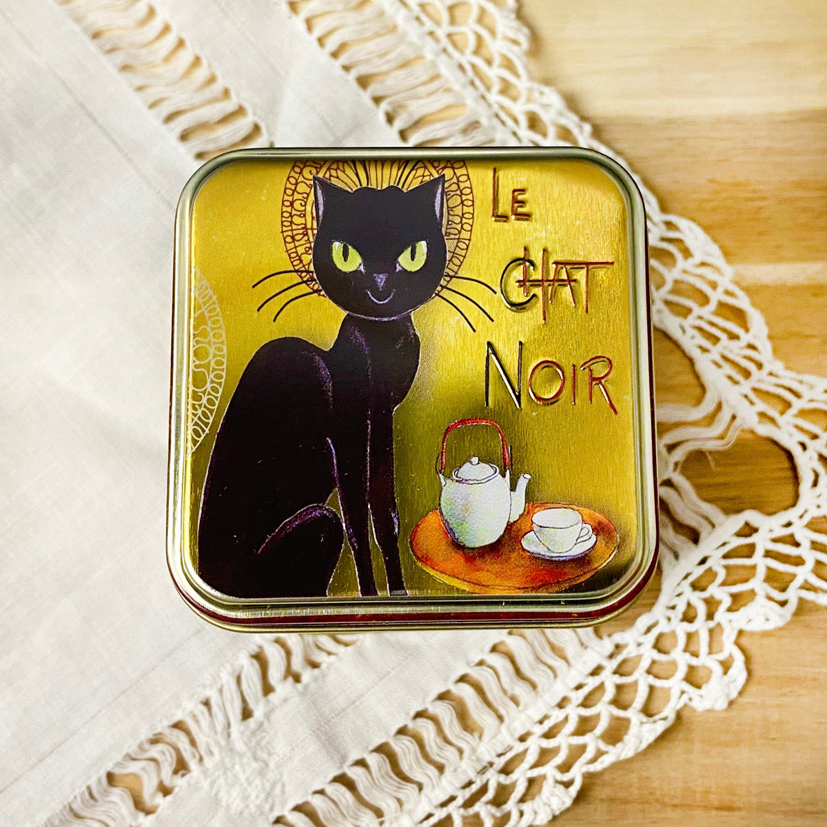 black cat tin top