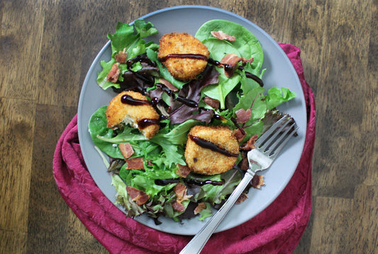 Fried Goat Cheese with Baby Greens, Bacon, + Balsamic