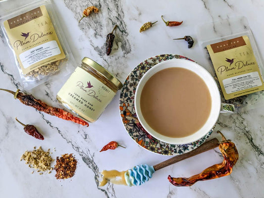 Hot honey, honey combined with spicy peppers, is all the rage right now, and it's for good reason. Hot honey is a delicious and versatile condiment, it even compliments tea. Here's our hot honey recipe with a Plum Deluxe twist.